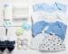 Flat lay composition with baby clothes and accessories on wooden background